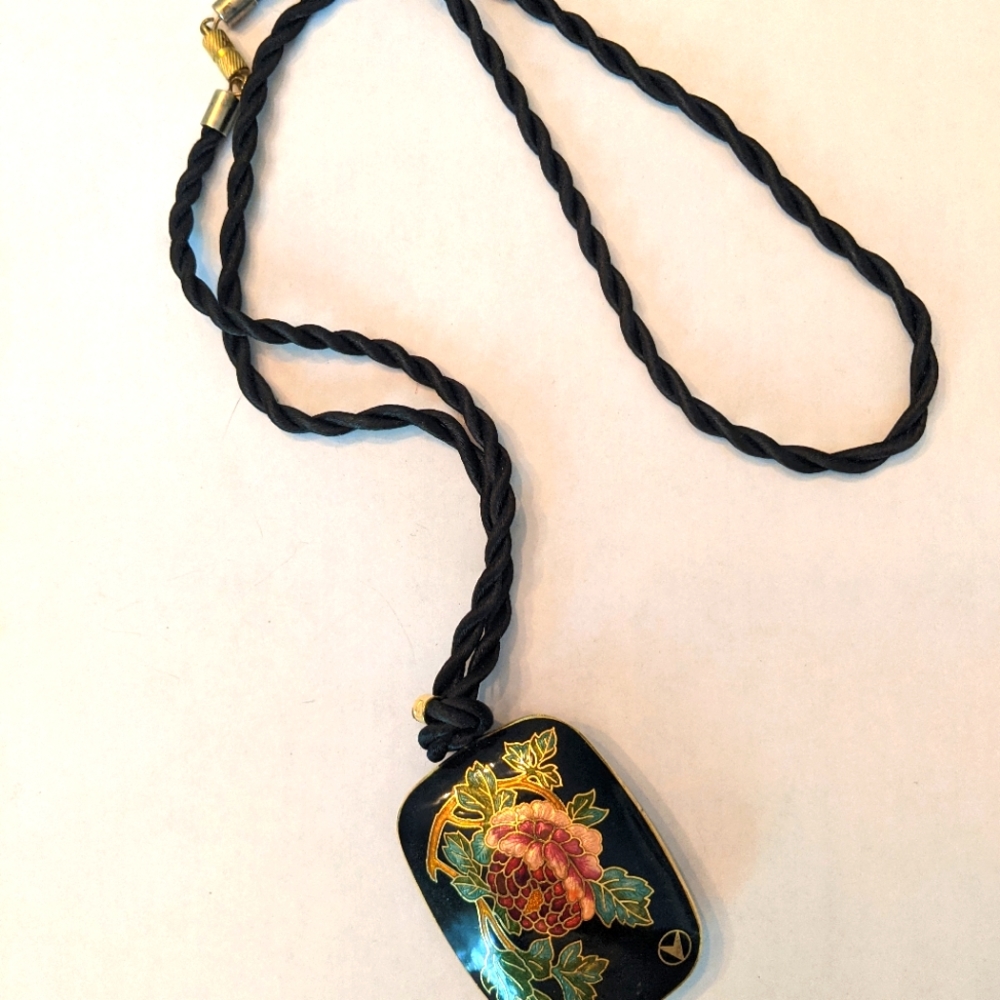 Cool black necklace with flower medallion